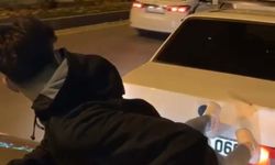 Muğla'da 2 otomobilin arasına uzanarak yapılan yolculuğa ceza
